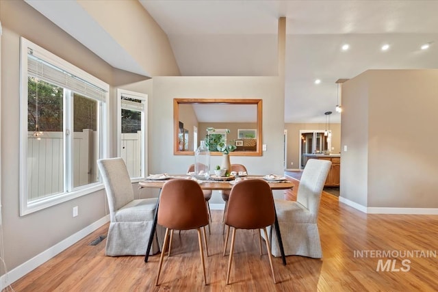 11909 W Patrina Dr, Boise, ID 83713 - dining room featuring light wood-type flooring, baseboards, recessed lighting, and lofted ceiling