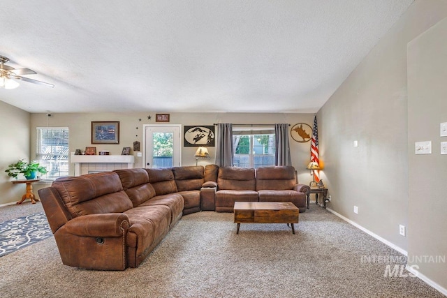 914 Aspenwood Ln, Twin Falls, ID 83301 - carpeted living area featuring a textured ceiling, a ceiling fan, and baseboards