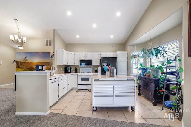 914 Aspenwood Ln, Twin Falls, ID 83301 - kitchen featuring white appliances, a sink, a chandelier, white cabinets, and light countertops