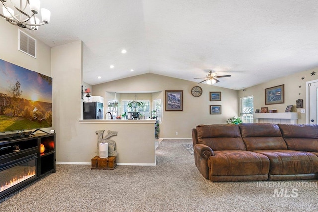 914 Aspenwood Ln, Twin Falls, ID 83301 - carpeted living room with a chandelier, ceiling fan, vaulted ceiling, baseboards, and recessed lighting