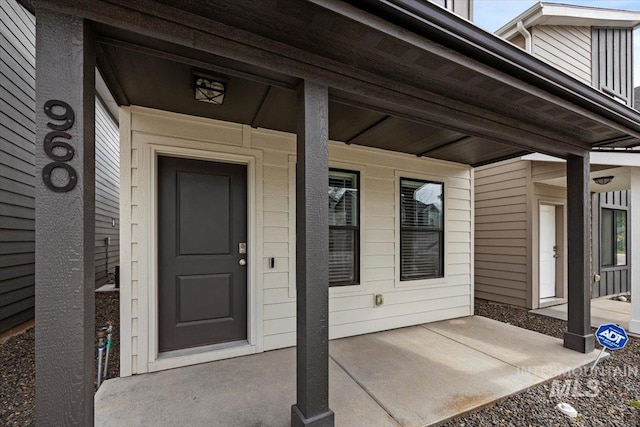 doorway to property with covered porch