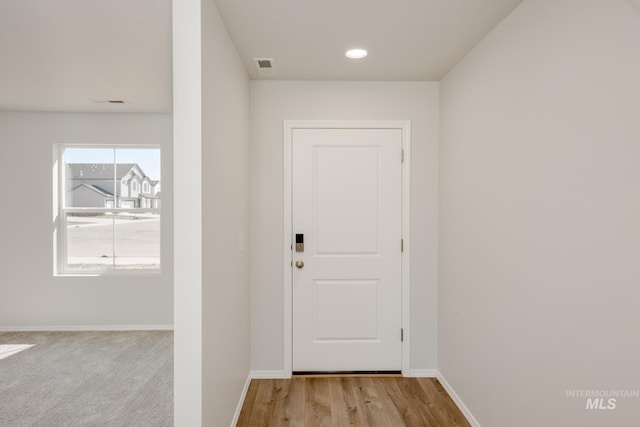 doorway with light hardwood / wood-style flooring