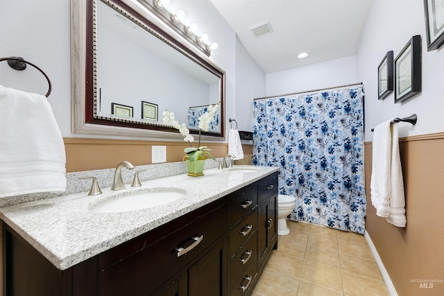 bathroom with tile patterned flooring, vanity, toilet, and a shower with shower curtain