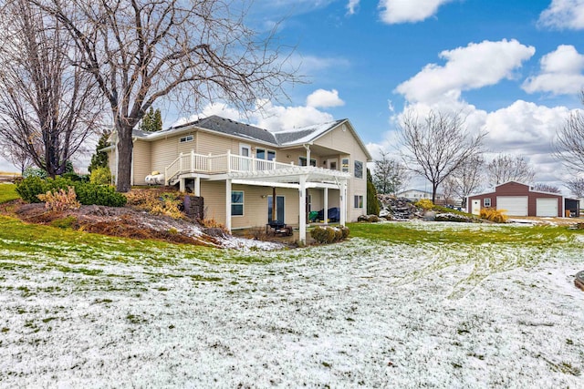 snow covered house with a deck