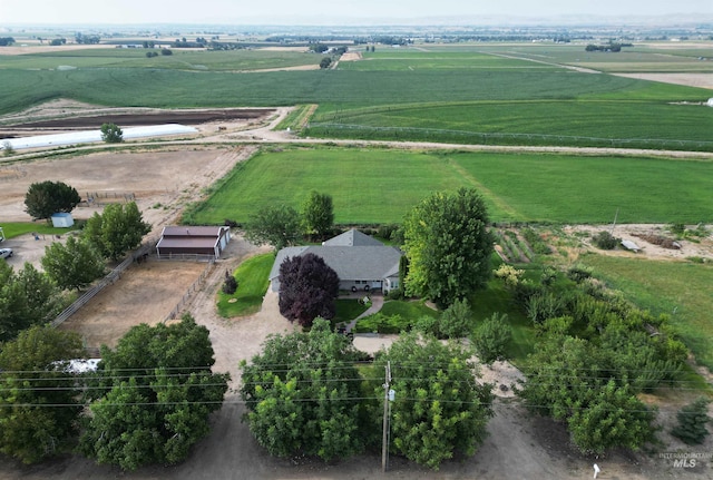 birds eye view of property with a rural view