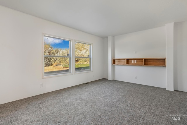 unfurnished living room with carpet