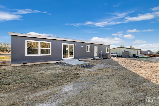 back of property with a patio and central AC unit