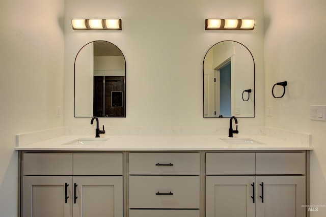 bathroom with double vanity and a sink