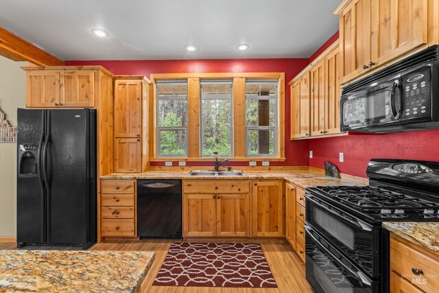 14199 Franklin Rd, Mccall, ID 83638 - kitchen with black appliances, light wood-style floors, light stone countertops, and recessed lighting