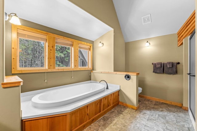 14199 Franklin Rd, Mccall, ID 83638 - bathroom featuring vaulted ceiling and a bath