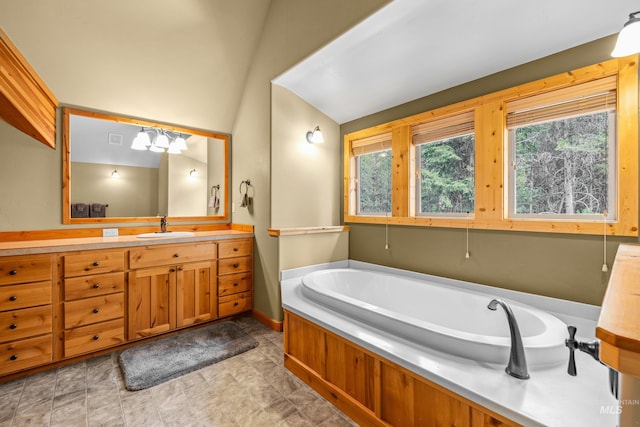 14199 Franklin Rd, Mccall, ID 83638 - full bath featuring vanity, a garden tub, and lofted ceiling