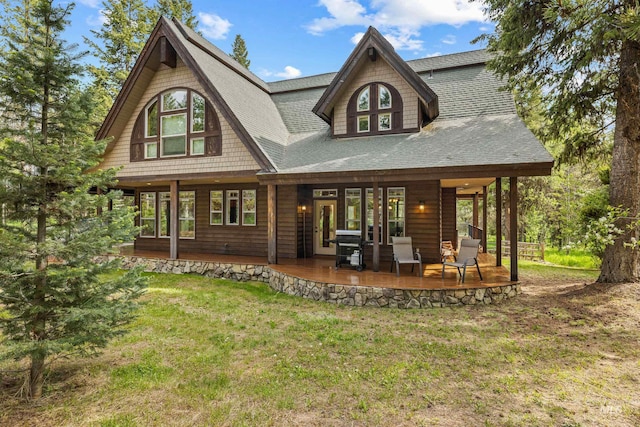 14199 Franklin Rd, Mccall, ID 83638 - rear view of house with a lawn and roof with shingles