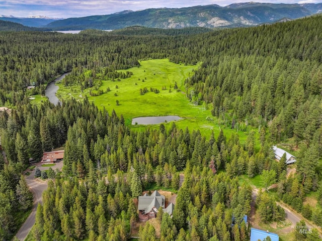 14199 Franklin Rd, Mccall, ID 83638 - drone / aerial view of a heavily wooded area and a mountain backdrop