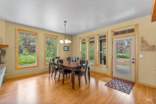 14199 Franklin Rd, Mccall, ID 83638 - dining room with a chandelier and light wood finished floors