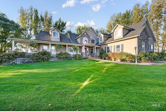 view of front of house featuring covered porch and a front lawn