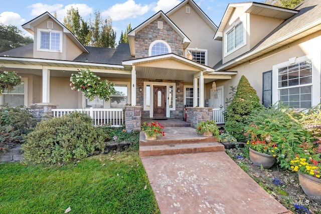 doorway to property featuring covered porch