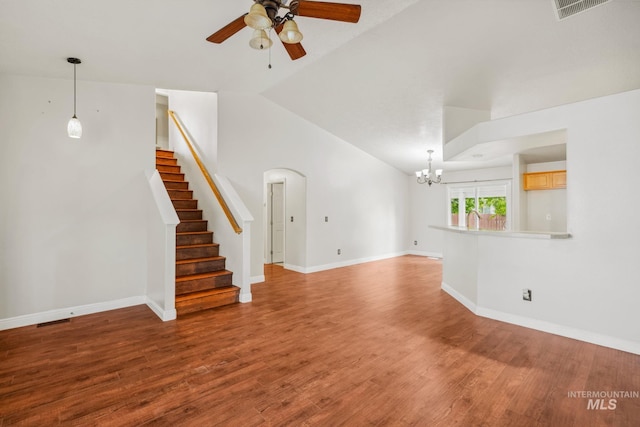 5101 Barkley Way, Caldwell, ID 83607 - unfurnished living room with a ceiling fan, lofted ceiling, wood finished floors, a chandelier, and stairs