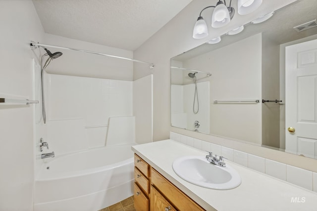5101 Barkley Way, Caldwell, ID 83607 - bathroom featuring vanity, bathing tub / shower combination, and a textured ceiling