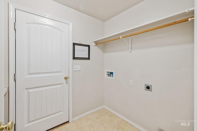 5101 Barkley Way, Caldwell, ID 83607 - laundry area featuring hookup for an electric dryer, hookup for a washing machine, baseboards, and a textured ceiling