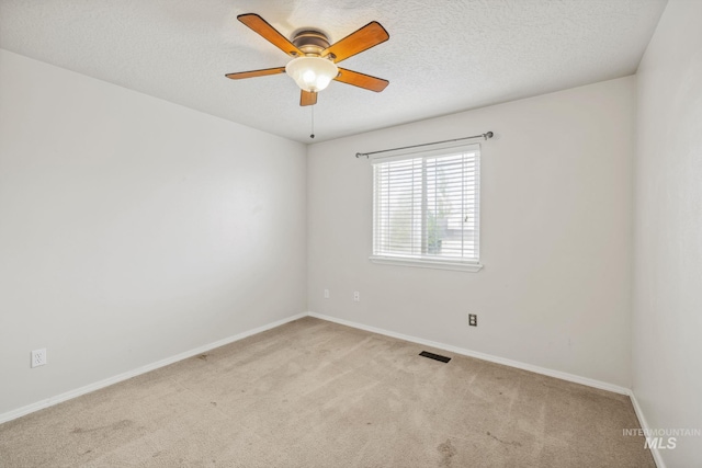 5101 Barkley Way, Caldwell, ID 83607 - carpeted spare room featuring baseboards, a ceiling fan, and a textured ceiling