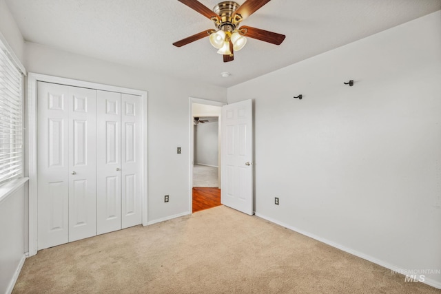 5101 Barkley Way, Caldwell, ID 83607 - unfurnished bedroom with carpet flooring, baseboards, a closet, and ceiling fan