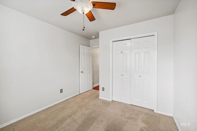 5101 Barkley Way, Caldwell, ID 83607 - unfurnished bedroom featuring carpet flooring, baseboards, a closet, ceiling fan, and a textured ceiling