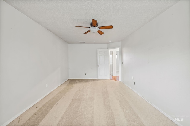 5101 Barkley Way, Caldwell, ID 83607 - empty room featuring a ceiling fan, a textured ceiling, baseboards, and light carpet