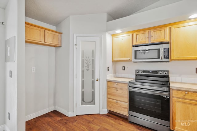 5101 Barkley Way, Caldwell, ID 83607 - kitchen with stainless steel appliances, light countertops, wood finished floors, and light brown cabinets