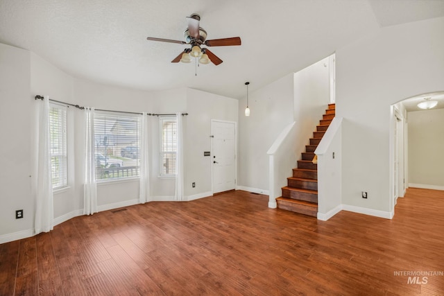 5101 Barkley Way, Caldwell, ID 83607 - foyer entrance with ceiling fan, arched walkways, wood finished floors, stairway, and baseboards