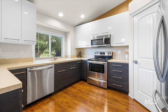 8096 E Jacob, Nampa, ID 83687 - kitchen with stainless steel appliances, modern cabinets, light countertops, white cabinets, and vaulted ceiling