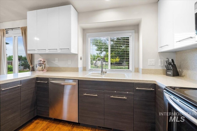 8096 E Jacob, Nampa, ID 83687 - kitchen featuring appliances with stainless steel finishes, white cabinetry, light countertops, and dark brown cabinets