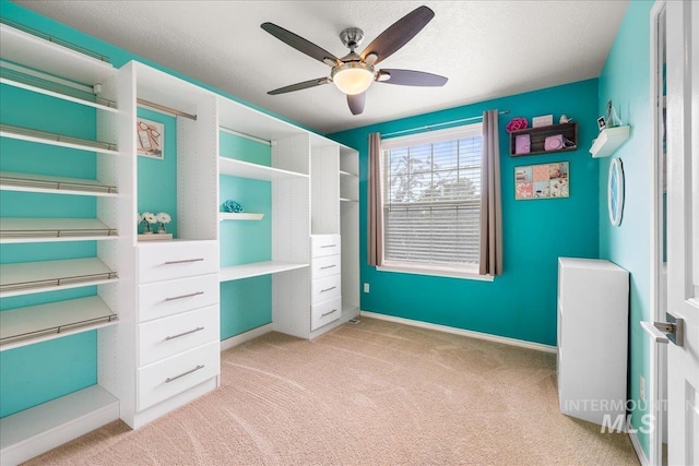 8096 E Jacob, Nampa, ID 83687 - unfurnished bedroom featuring light colored carpet, built in study area, and a ceiling fan
