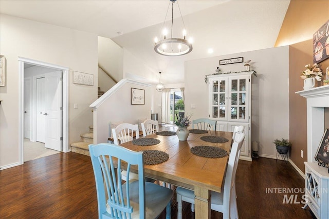 8096 E Jacob, Nampa, ID 83687 - dining space featuring stairway, vaulted ceiling, wood finished floors, and a chandelier