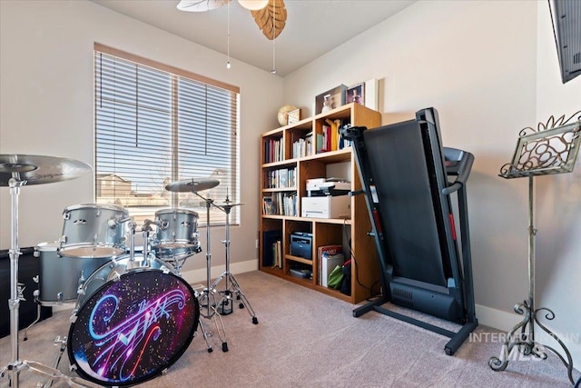 playroom with carpet, baseboards, and ceiling fan