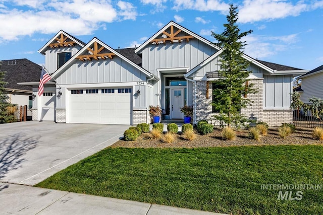 view of front of home featuring board and batten siding, concrete driveway, a garage, and brick siding