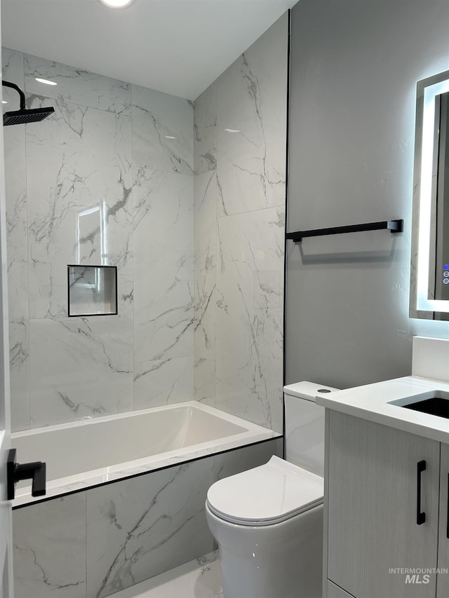 full bath with vanity, toilet, bathing tub / shower combination, and marble finish floor