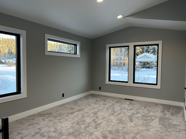 carpeted spare room with recessed lighting, baseboards, visible vents, and lofted ceiling
