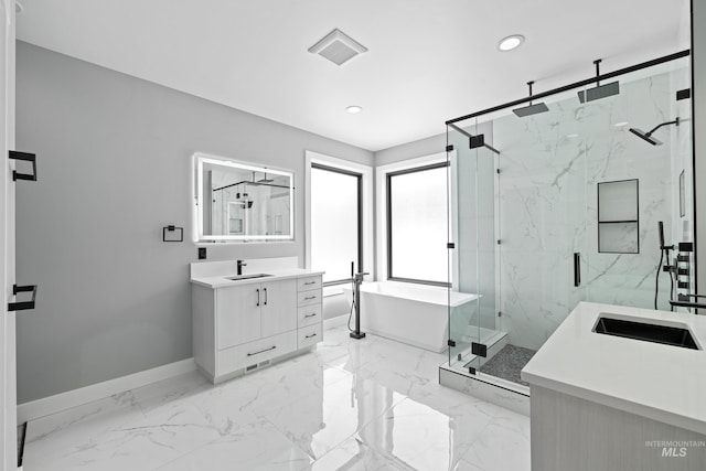bathroom with baseboards, marble finish floor, a marble finish shower, and vanity