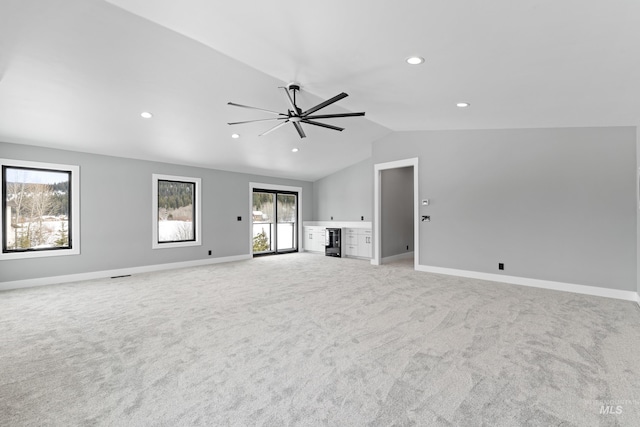 224 Meadow Lake Ct, Mccall, ID 83638 - unfurnished living room featuring lofted ceiling, light colored carpet, a ceiling fan, recessed lighting, and baseboards