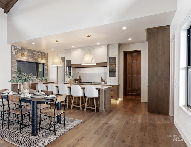 dining space with light wood-type flooring and recessed lighting
