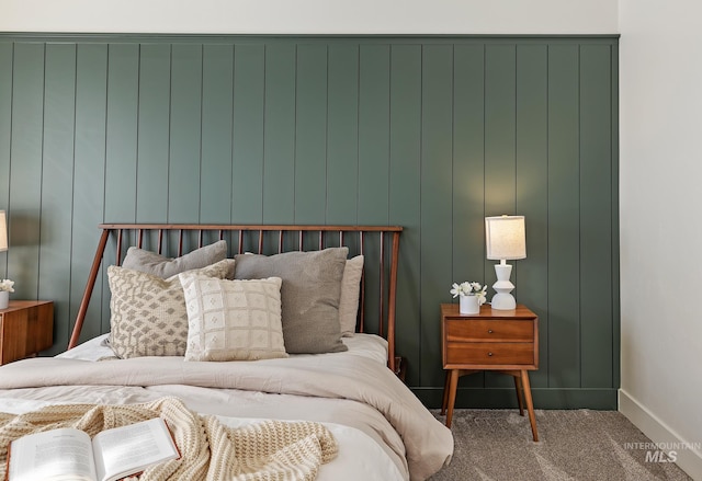 bedroom featuring carpet flooring and baseboards