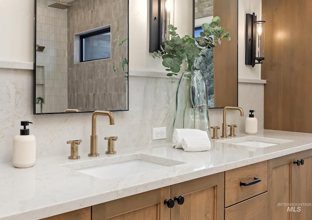 bathroom featuring double vanity, a sink, and backsplash