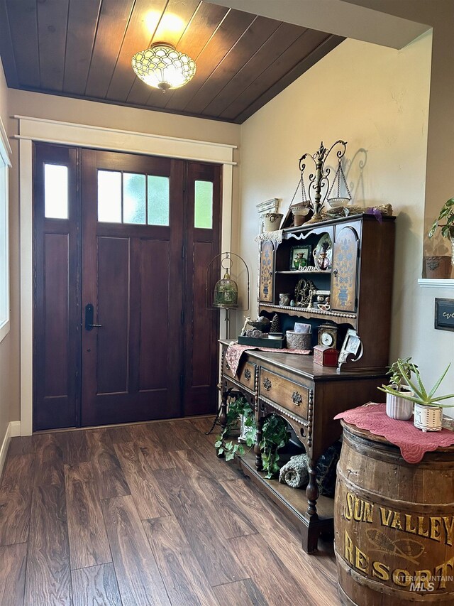 foyer entrance featuring hardwood / wood-style flooring and wood ceiling