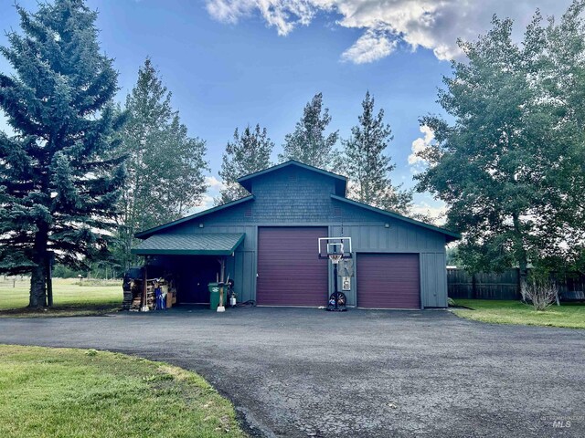 garage featuring a lawn