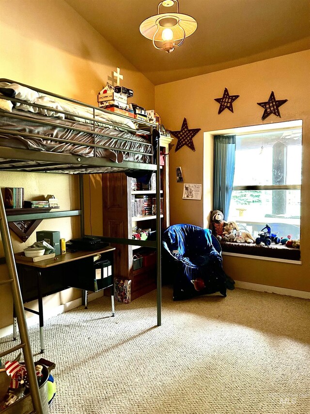 bedroom featuring light carpet and lofted ceiling