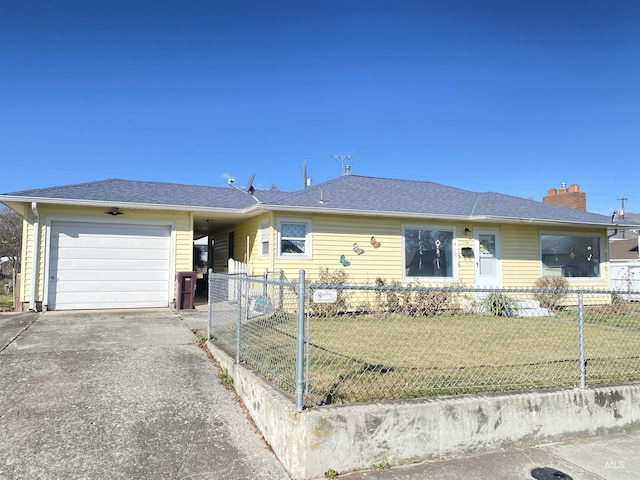 single story home with driveway, a shingled roof, a fenced front yard, an attached garage, and a front lawn