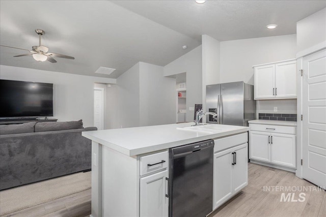 5144 W W Grand Rapids Dr, Meridian, ID 83646 - kitchen featuring black dishwasher, stainless steel fridge, a sink, light wood-style flooring, and a ceiling fan