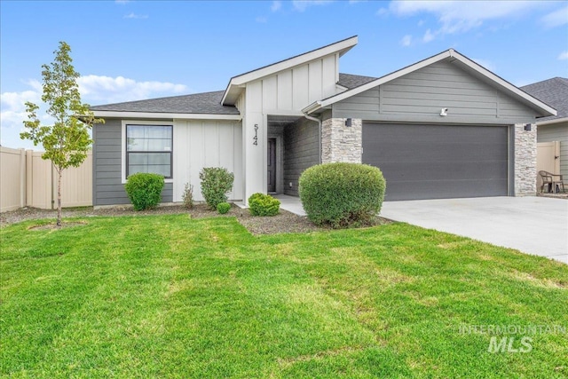 5144 W W Grand Rapids Dr, Meridian, ID 83646 - view of front facade with board and batten siding, a garage, concrete driveway, stone siding, and roof with shingles