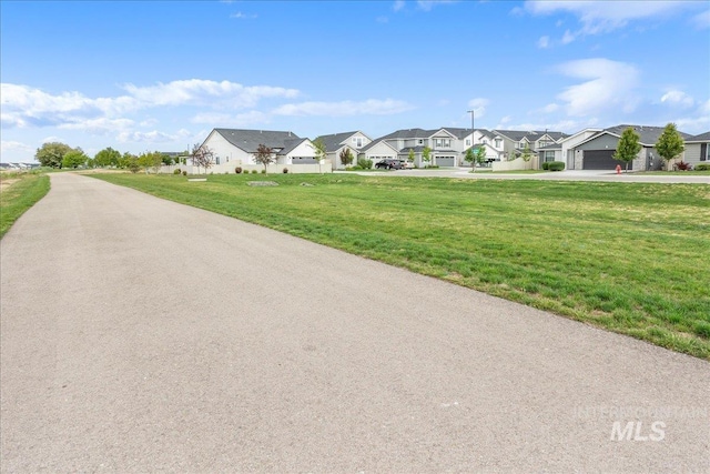 5144 W W Grand Rapids Dr, Meridian, ID 83646 - view of asphalt road featuring a residential view