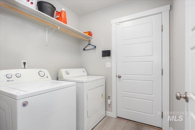 5144 W W Grand Rapids Dr, Meridian, ID 83646 - washroom with washer and clothes dryer, light wood finished floors, and baseboards
